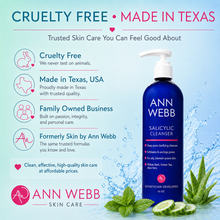 Load image into Gallery viewer, Ann Webb Salicylic Cleanser pump bottle in a blue bottle with a white pump dispenser, set against a light blue water splash background with mint leaves and cucumber slices. The left side features marketing text and icons for cruelty-free and made in Texas claims.