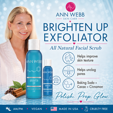 Load image into Gallery viewer, Ann Webb Skin Care Brighten Up Exfoliator ad featuring a smiling blonde woman in a white robe alongside two blue bottles of facial scrub, with product benefits listed on a light blue background.