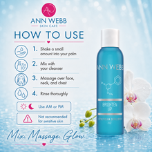 Load image into Gallery viewer, Ann Webb Skin Care Brighten Up sunscreen in a blue bottle, displayed next to a detailed 'How to Use' guide on a light blue water-themed background with white orchids.