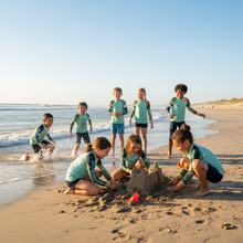 Load image into Gallery viewer, Kids BLue Green Abstract Print Rash Guards Whimsy FIt Mix and Match “Sink or Swim” Matching Mom Group of Children Playing on Beach