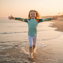 Load image into Gallery viewer, Kids BLue Green Abstract Print Rash Guards Whimsy FIt Mix and Match “Sink or Swim” Matching Mom Child Running Along Shoreline