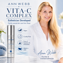 Load image into Gallery viewer, Ann Webb Vita-C Complex skincare bottle shown next to a smiling blonde woman in a white robe, with marketing text and icons on a bright white background.