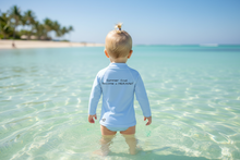 Load image into Gallery viewer, Back view of rash guard with text - child in water