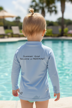 Load image into Gallery viewer, Close-up back view of rash guard with text