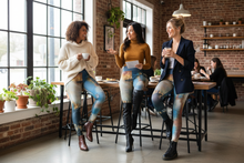 Load image into Gallery viewer, Women at coffee shop wearing Texas Tea leggings