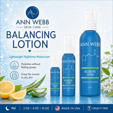 Load image into Gallery viewer, Three blue bottles of Ann Webb Balancing Lotion in different sizes arranged on a light blue background with lemon slices, aloe vera, and white flowers. The image includes product text highlighting lightweight nighttime moisturizer benefits.

