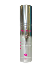 Load image into Gallery viewer, A cylindrical silver cosmetic bottle of AnnVibe HA Serum with a reflective metallic cap, featuring pink and white text on a clean white background.
