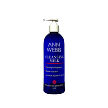 Load image into Gallery viewer, A 16 oz pump bottle of Ann Webb Cleansing Milk against a plain white background. The bottle is a deep cobalt blue with white text and a red accent line on the label, topped with a white pump dispenser.
