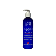 Load image into Gallery viewer, A 16 oz pump bottle of Ann Webb Cleansing Milk Sensitive, featuring a deep cobalt blue bottle, white pump dispenser, and white text on the label, set against a plain white background.
