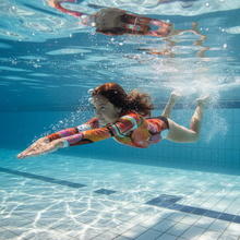 Load image into Gallery viewer, Circle in the Sand Girls Rash Guard Whimsy Fit UPF 50+ Long Sleeve Swim Shirt Swimming pool action shot
