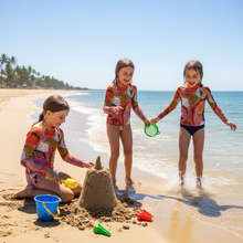 Load image into Gallery viewer, Circle in the Sand Girls Rash Guard Whimsy Fit UPF 50+ Long Sleeve Swim Shirt Children on beach in rash guards
