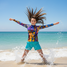Load image into Gallery viewer, Breeze Bright Girls Rash Guard Whimsy Fit UPF 50+ Long Sleeve Swim Shirt - Action Shot
