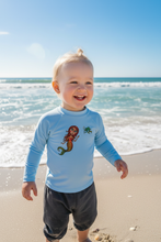 Load image into Gallery viewer, Child at beach shoreline wearing rash guard
