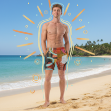 Load image into Gallery viewer, Men's orange-red abstract print swim trunks Circles in the Sand design - Whimsy Fit marketing lifestyle photo"
